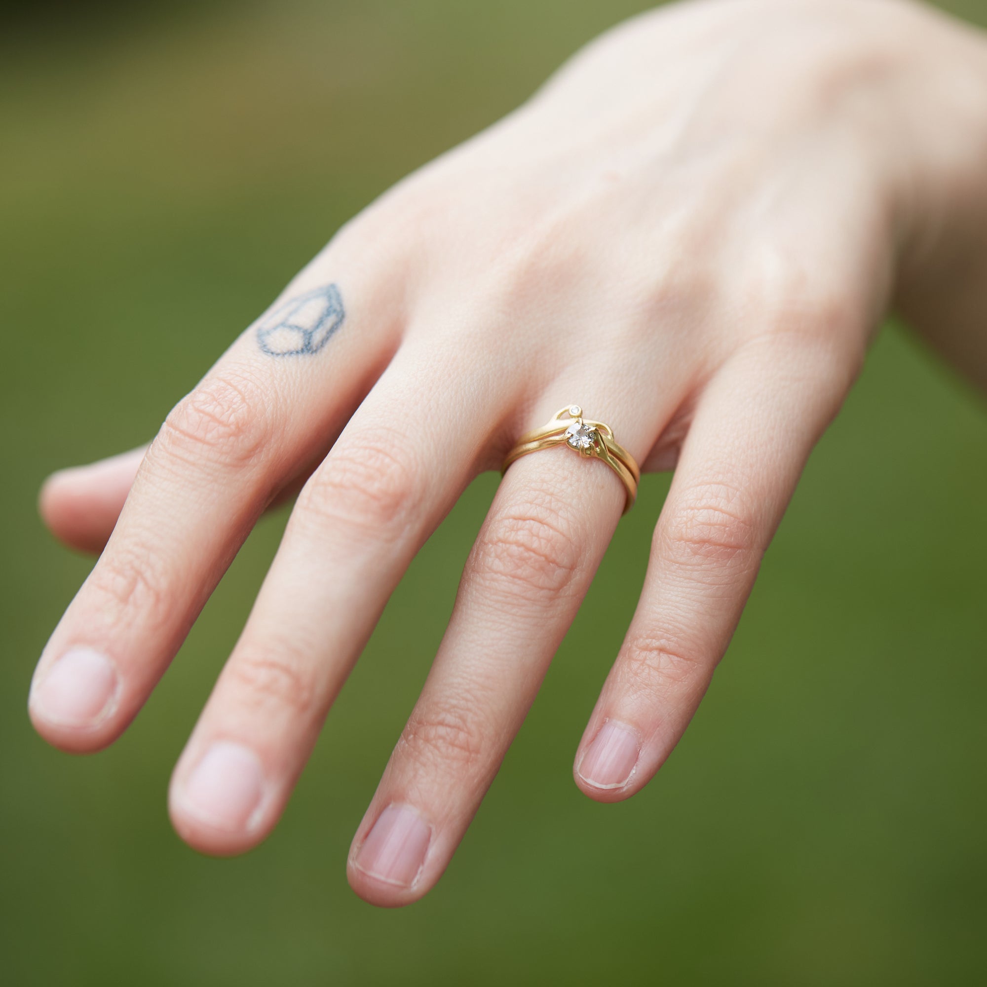 little salt and pepper diamond ring set in gold branches. by hannah blount