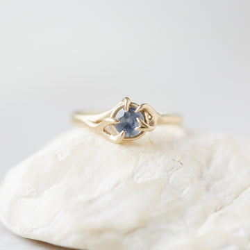 ring of grey blue montana sapphire set in gold branches by hannah blount