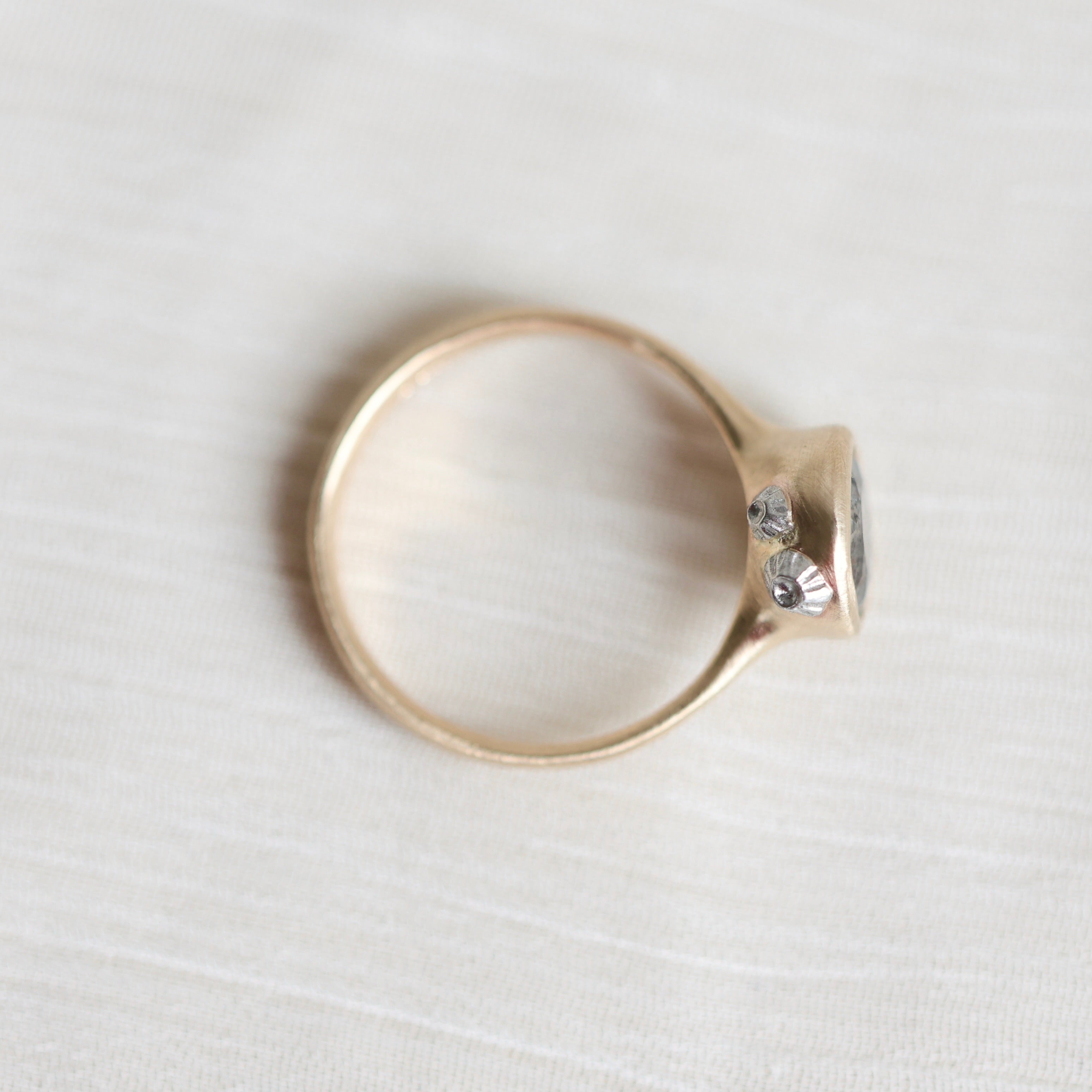 Gold ring on a white background