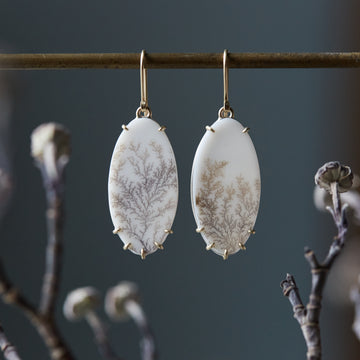 white snowy dendritic agate drop earrings with gold prongs by hannah blount
