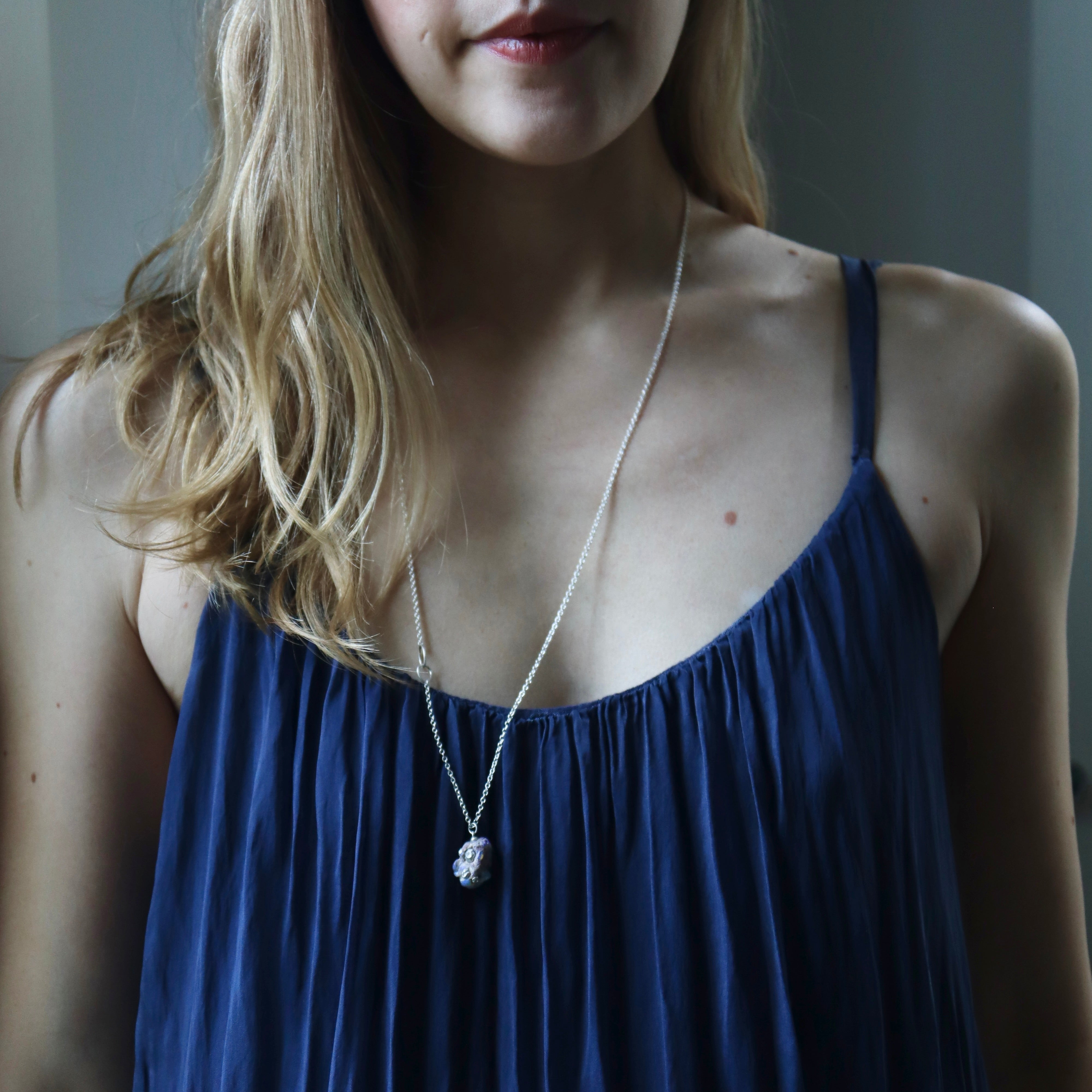 Raw opal silver necklace with barnacles by Hannah Blount