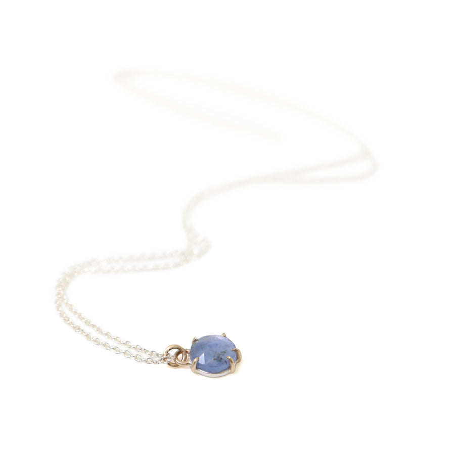 little pale blue sapphire pendant necklace with gold prongs by hannah blount