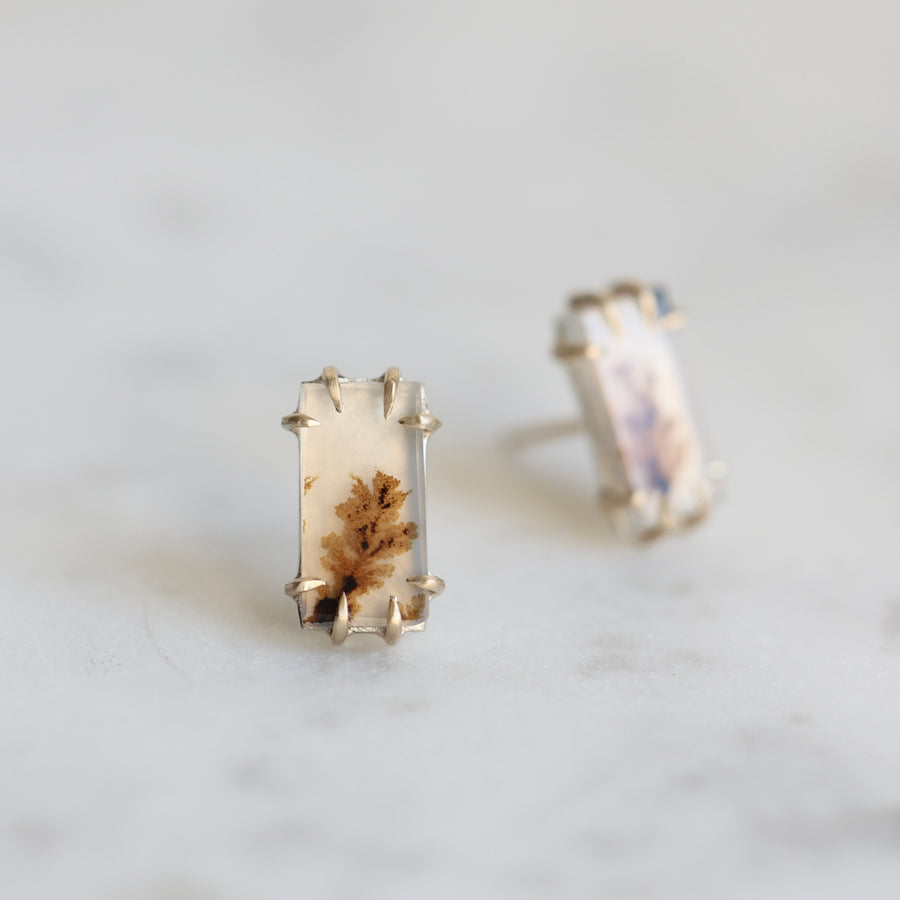 Rectangular earrings with a natural stone design on a light gray background