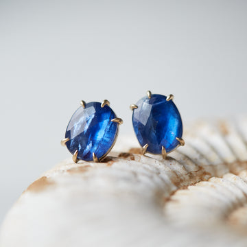 blue kyanite stud earrings with gold prongs by hannah blount