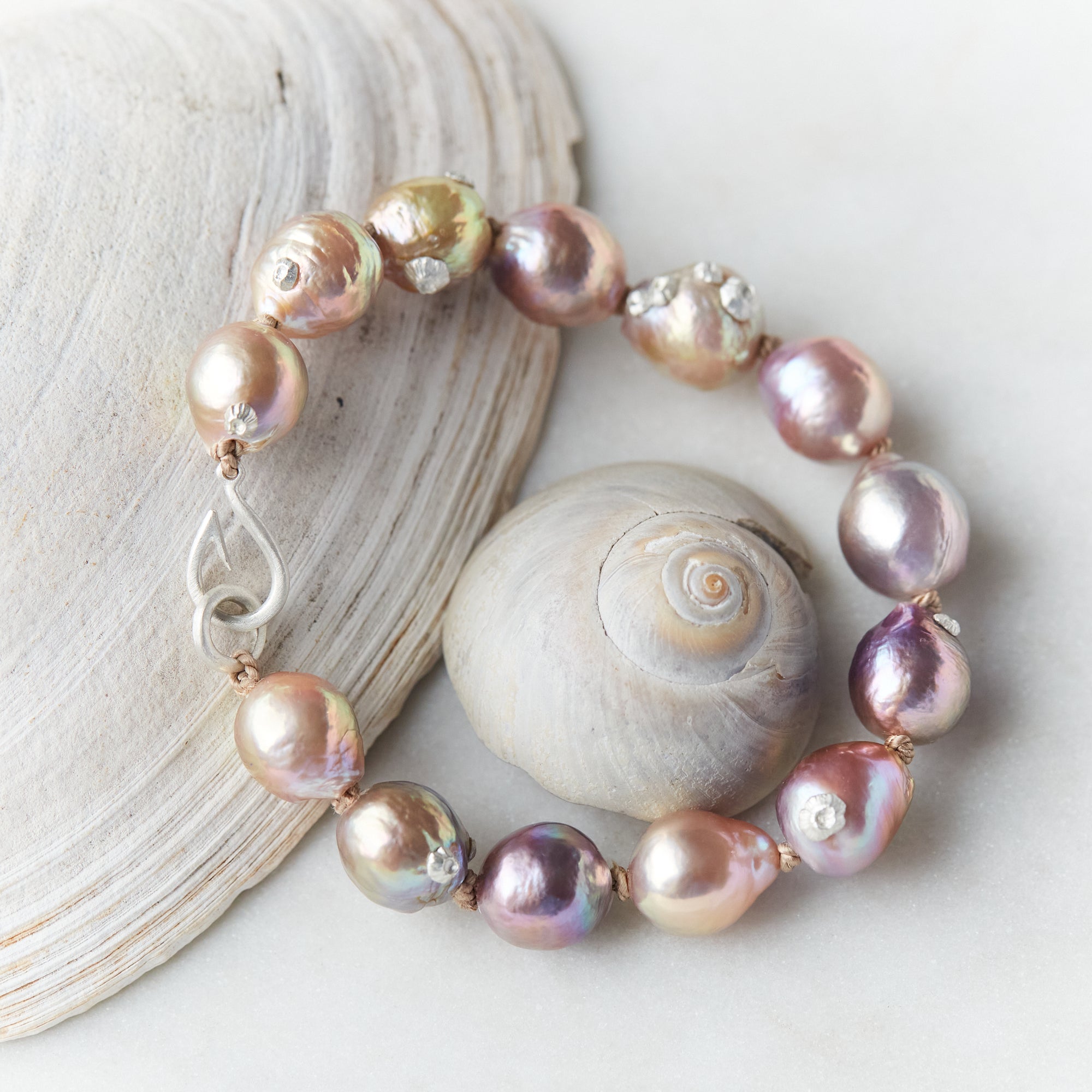 Pink freshwater pearl bracelet with silver barnacles and fish hook clasp by Hannah Blount