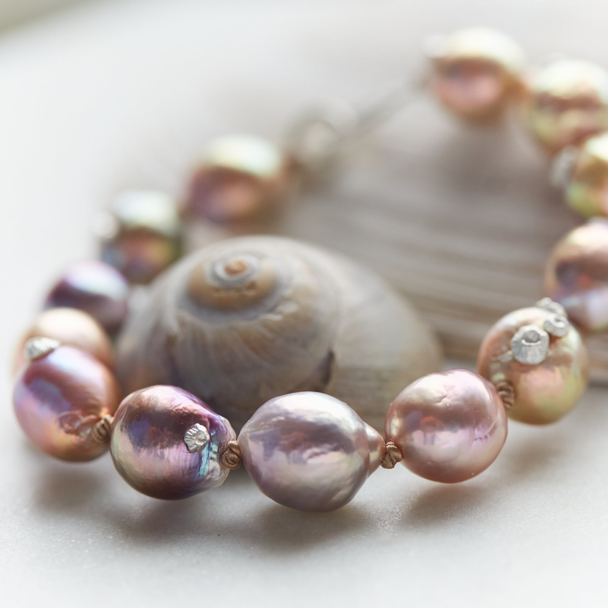 Pink freshwater pearl bracelet with silver barnacles and fish hook clasp by Hannah Blount
