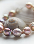 Pink freshwater pearl bracelet with silver barnacles and fish hook clasp by Hannah Blount