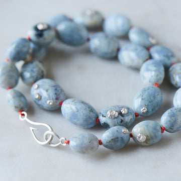 Indian opal necklace with coral-hued silk and silver clasp by Hannah Blount
