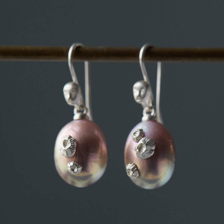 lavender pink pearl earrings with silver barnacles and silver cameo ear wires with faces, by hannah blount