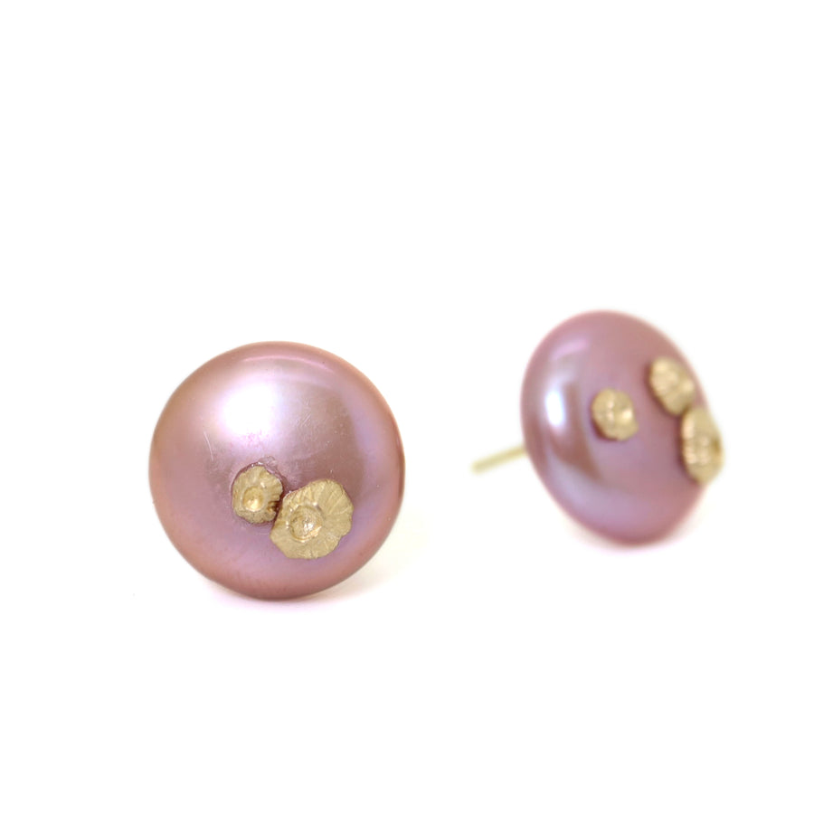 front and side view of large pink button pearl studs with five gold barnacles by hannah blount