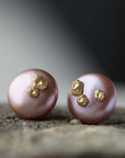 large pink button pearl studs with five gold barnacles by hannah blount