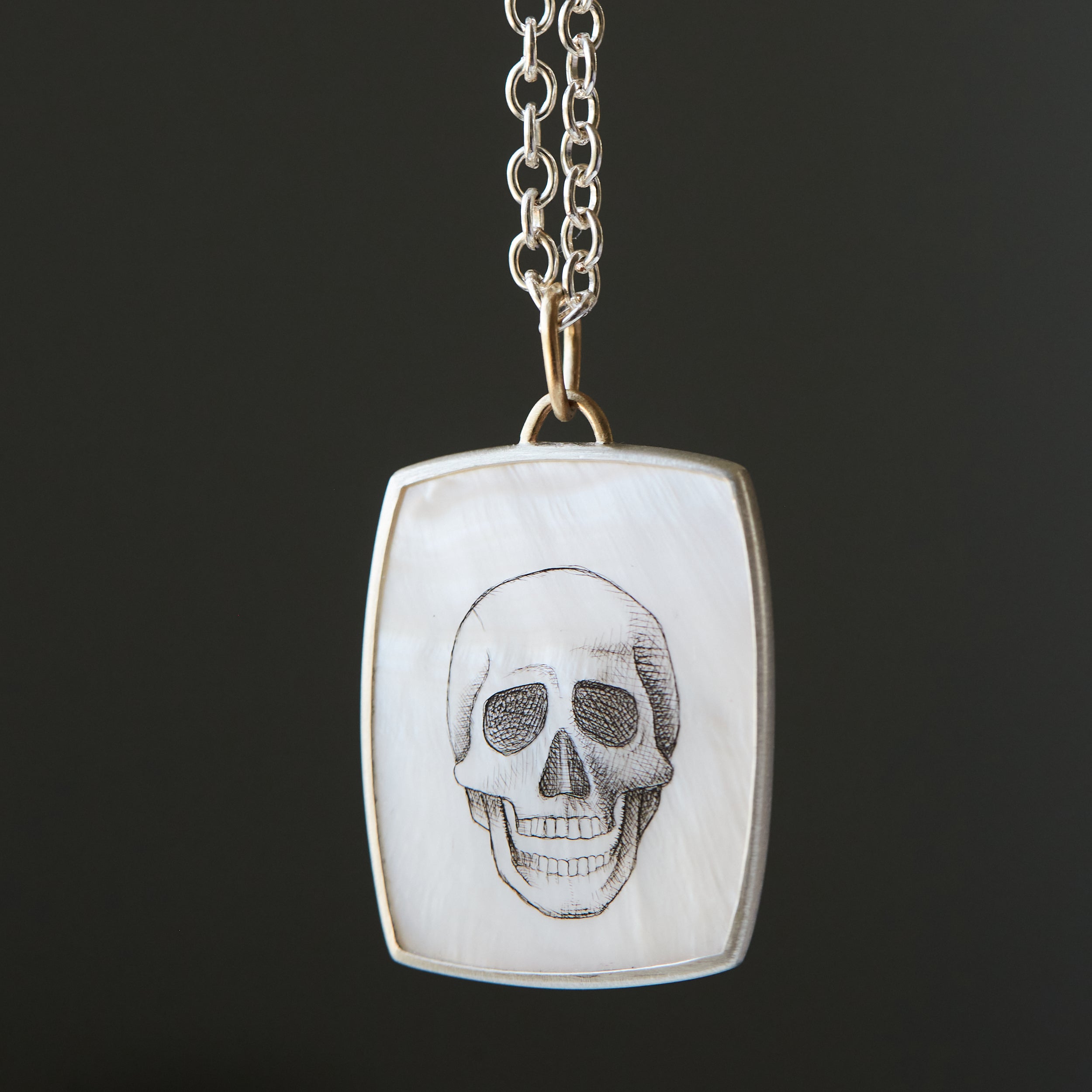 Hand drawn skull scrimshaw on mother of pearl - necklace