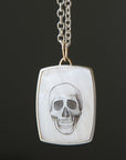 Hand drawn skull scrimshaw on mother of pearl - necklace