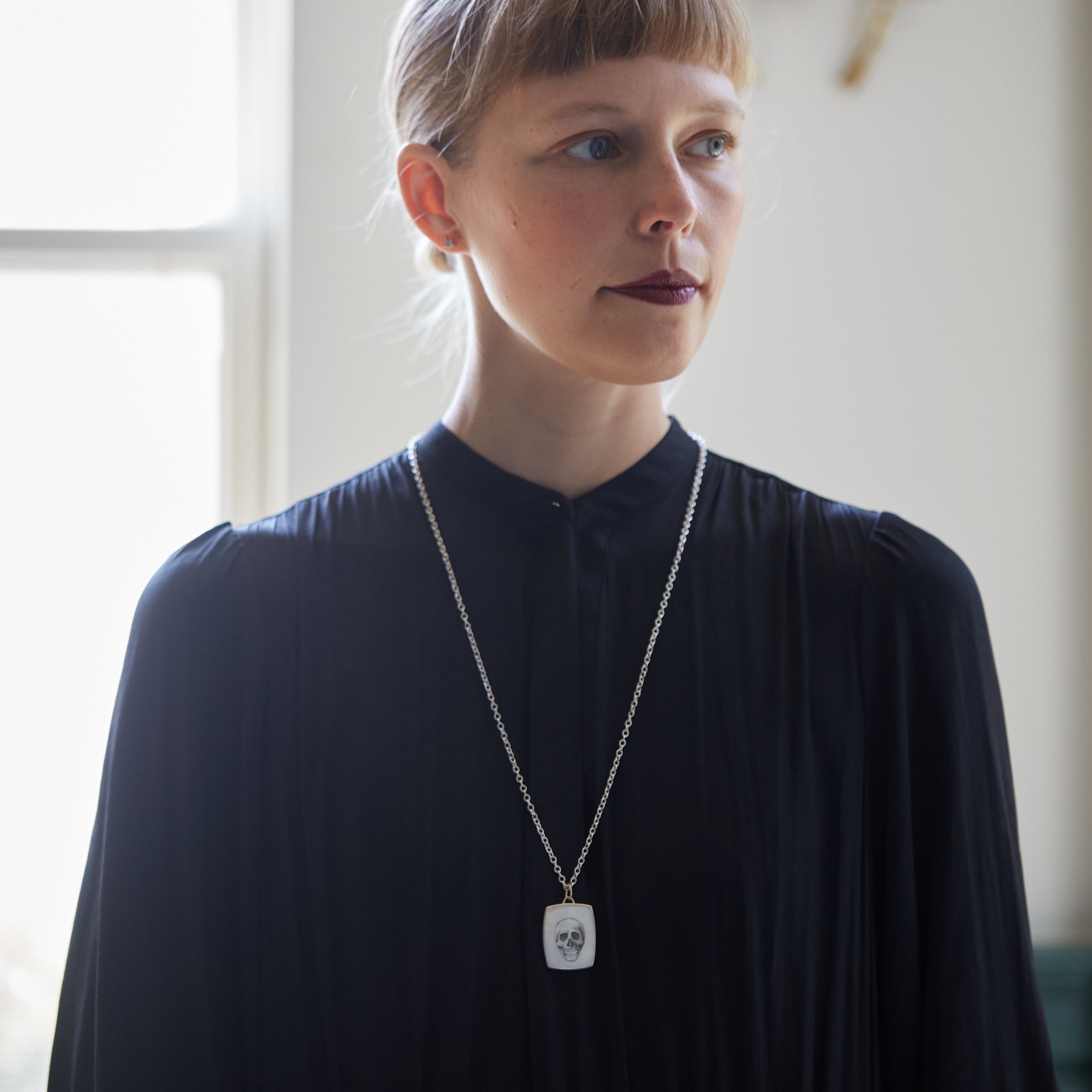 Skull scrimshaw on mother of pearl - necklace