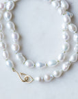 Baroque white freshwater pearl Ruthie B. necklace with aloe-hued silk and gold clasp by Hannah Blount