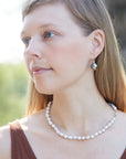Baroque white freshwater pearl Ruthie B. necklace with aloe-hued silk and gold clasp by Hannah Blount