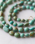 Kingman turquoise double-strand necklace with burnt sienna-hued silk and gold clasp by Hannah Blount