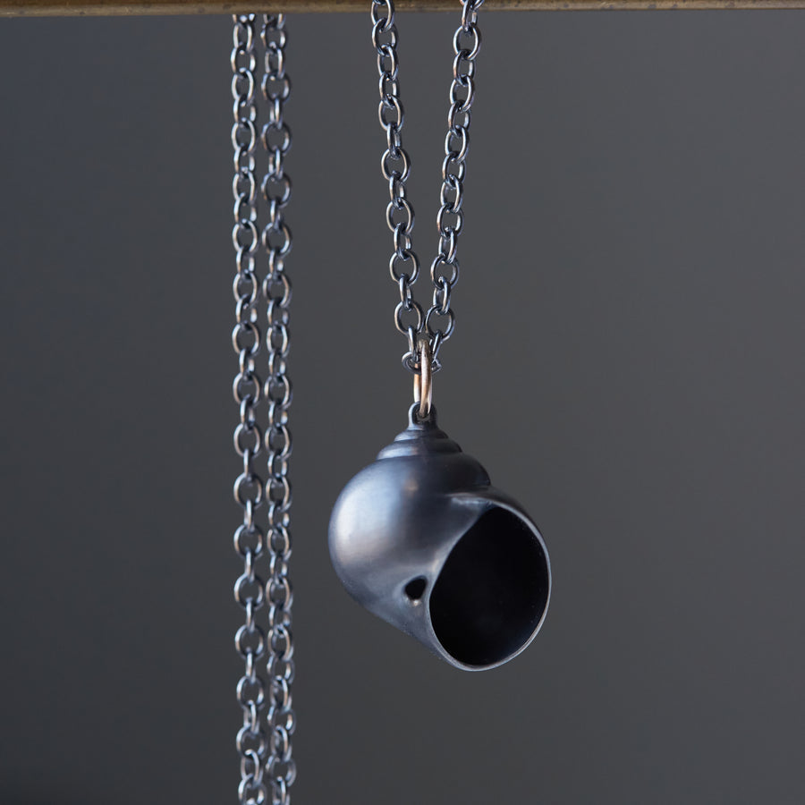 Oxidized silver moon snail shell necklace by Hannah Blount