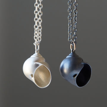 Silver moon snail shell necklace by Hannah Blount