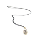 Mother-of-pearl Scrimshaw hourglass necklace by Hannah Blount