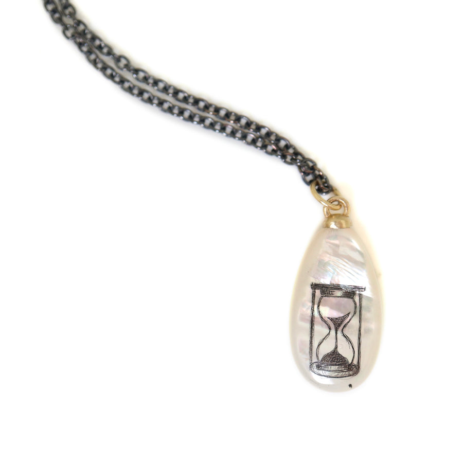 Mother-of-pearl Scrimshaw hourglass necklace by Hannah Blount