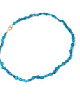 Raw Kingman turquoise necklace with coral-hued silk and gold clasp by Hannah Blount