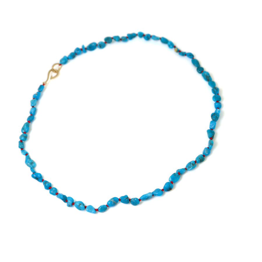 Raw Kingman turquoise necklace with coral-hued silk and gold clasp by Hannah Blount