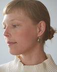 Green vanity earrings by Hannah Blount