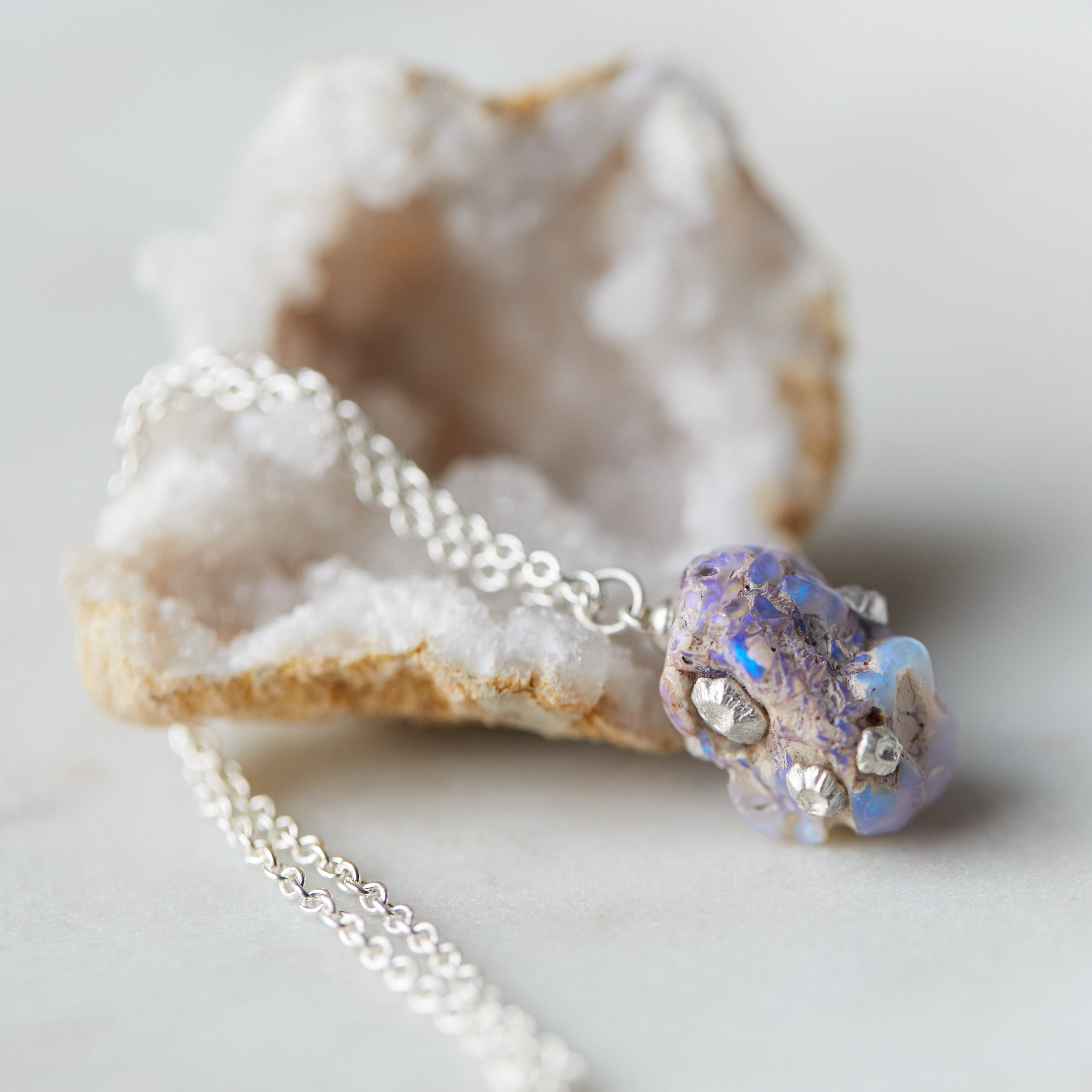Raw opal silver necklace with barnacles by Hannah Blount