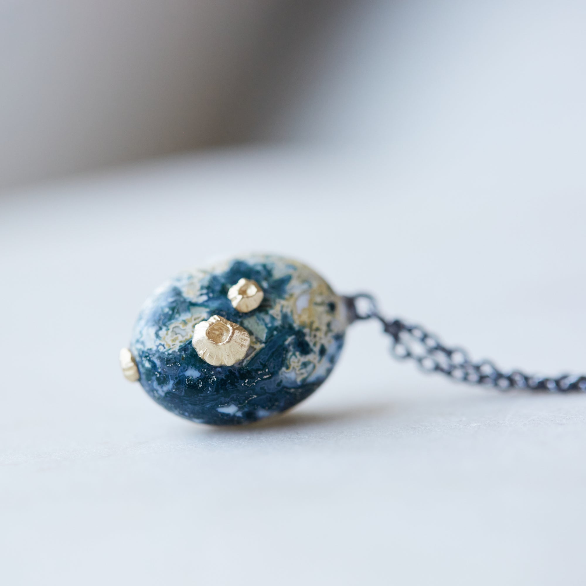 Opal necklace with gold barnacles by Hannah Blount