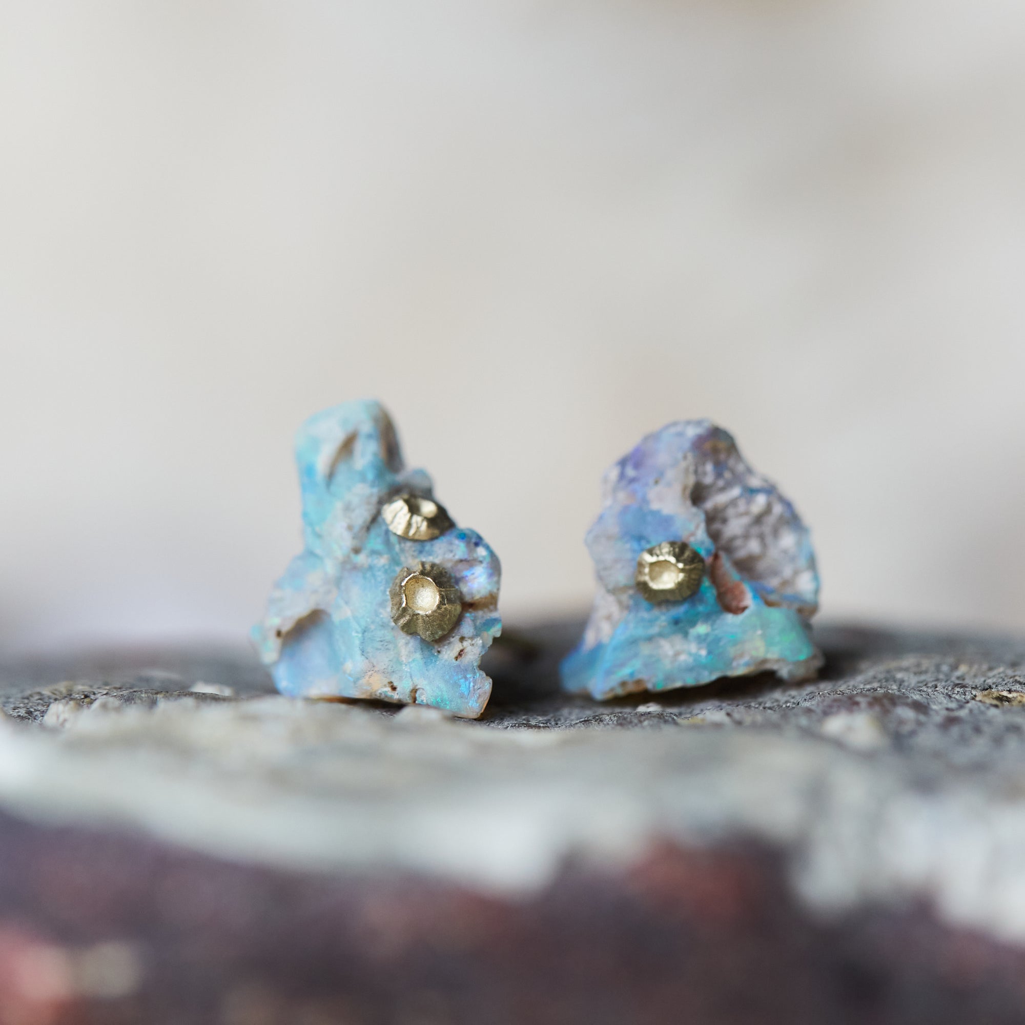 Raw opal studs with gold barnacles by Hannah Blount