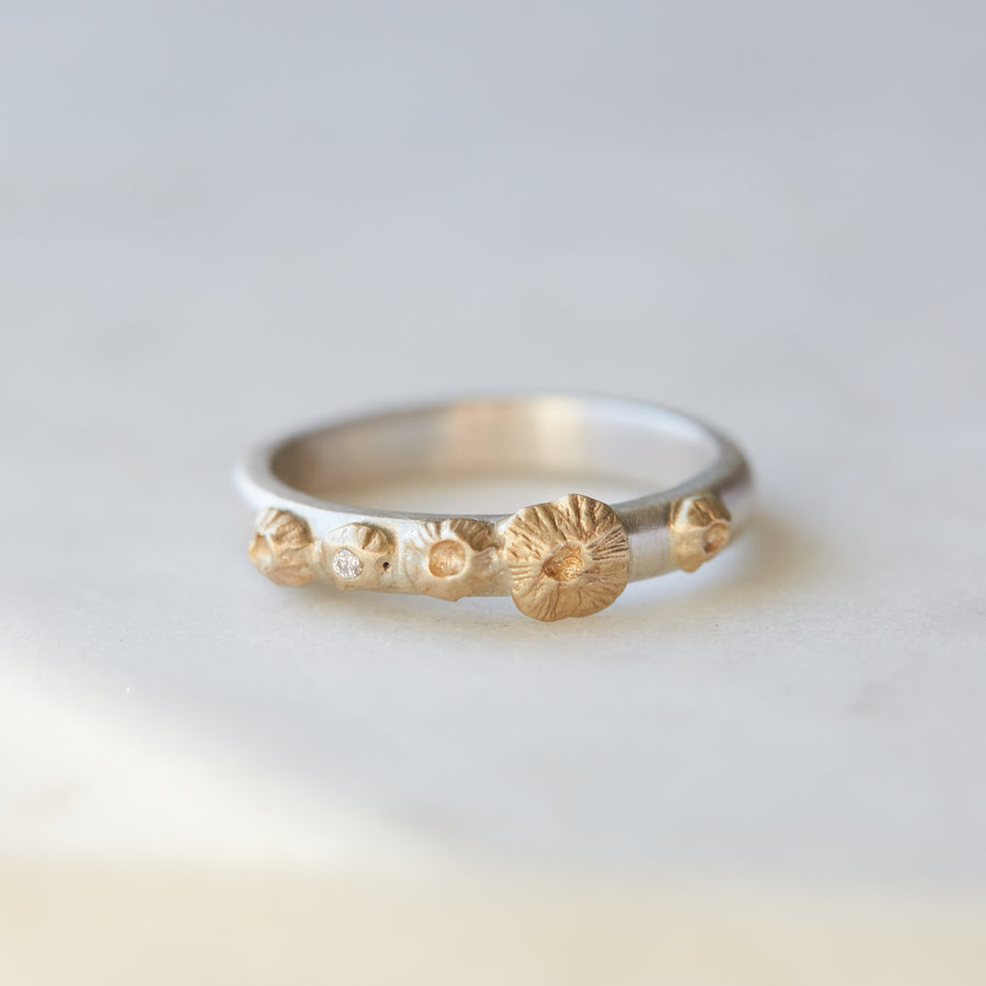 Silver ring with gold barnacles + diamond by Hannah Blount
