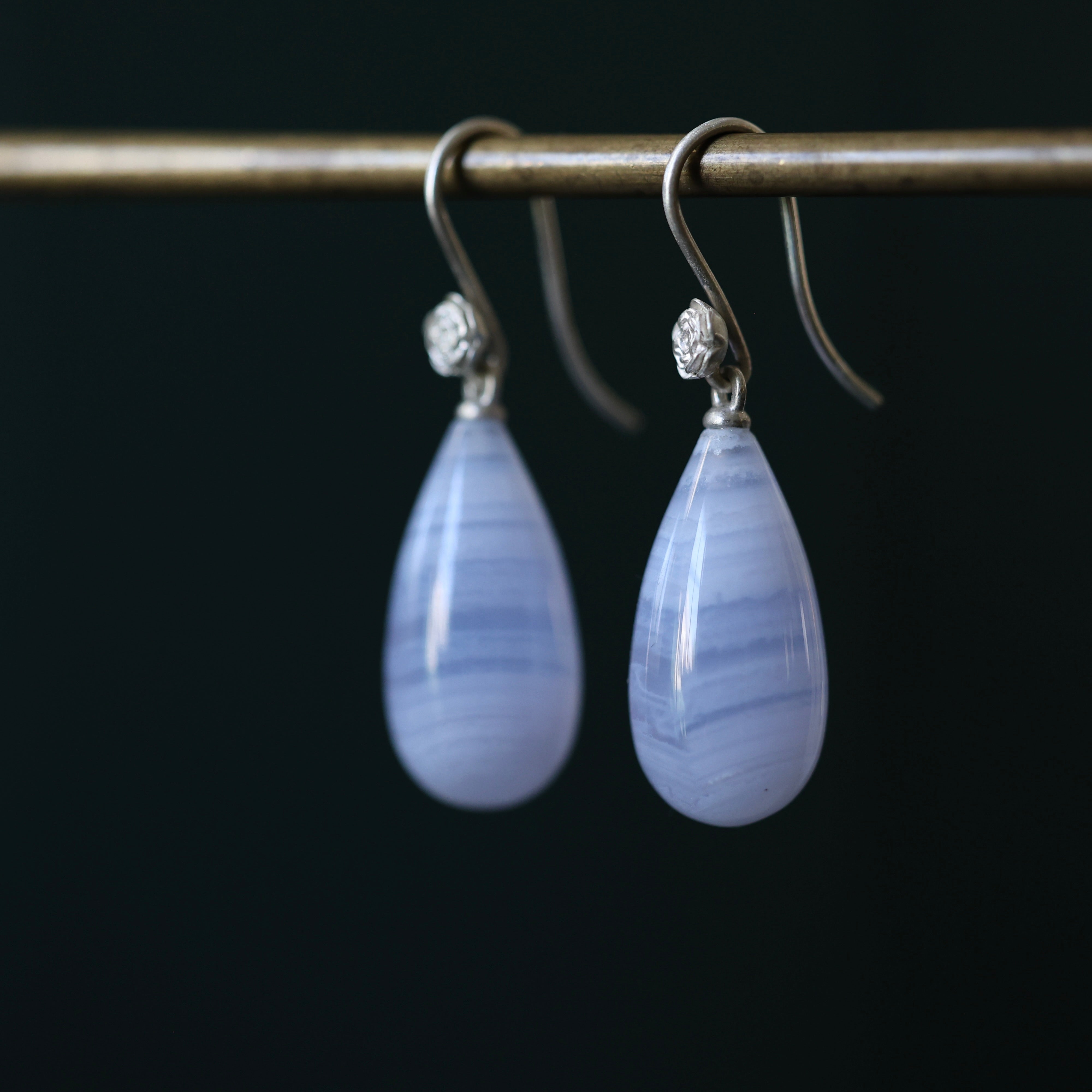 Lace Agate teardrop shaped earrings with bright sterling silver ear wires and rose accents. 