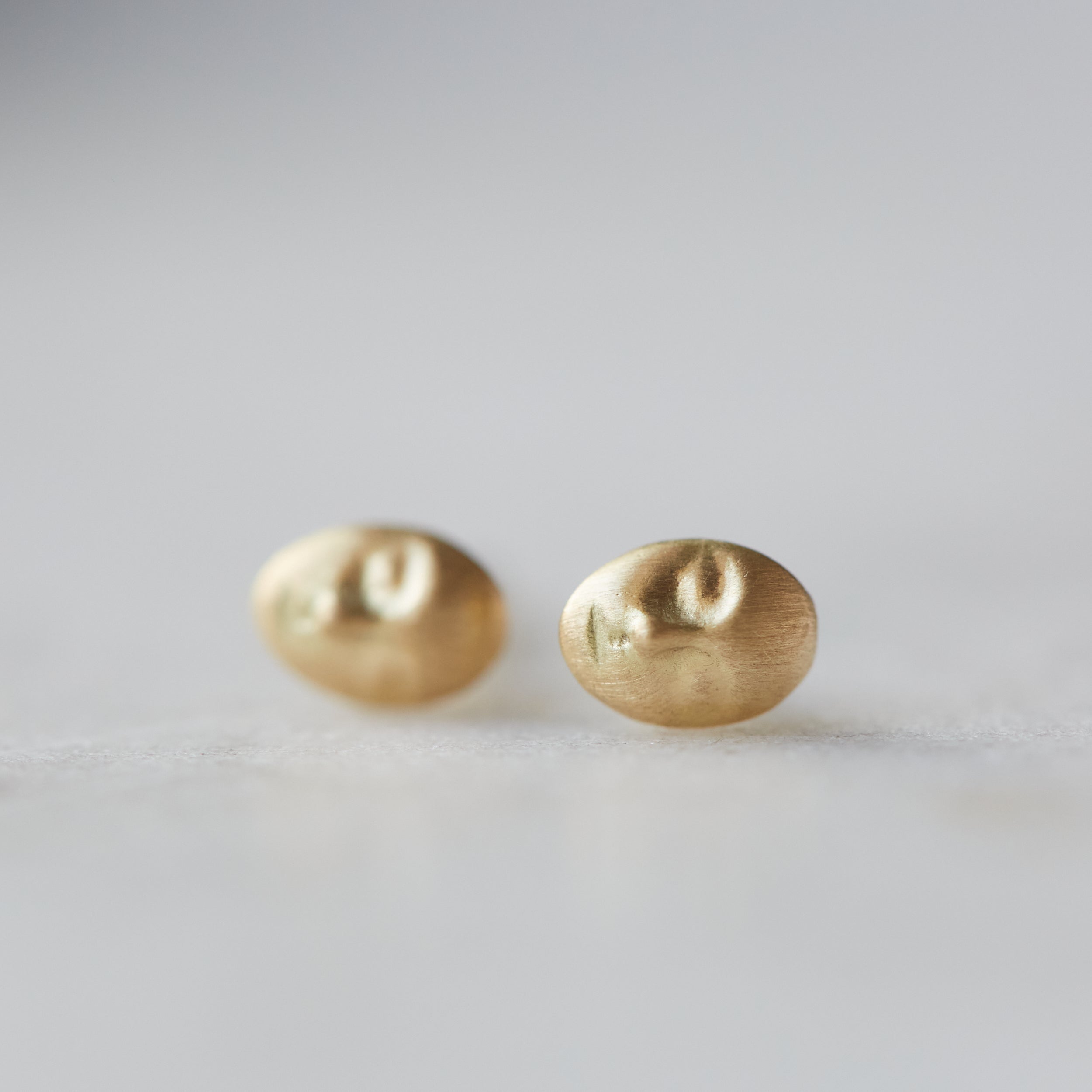Cameo gold stud earring by Hannah Blount