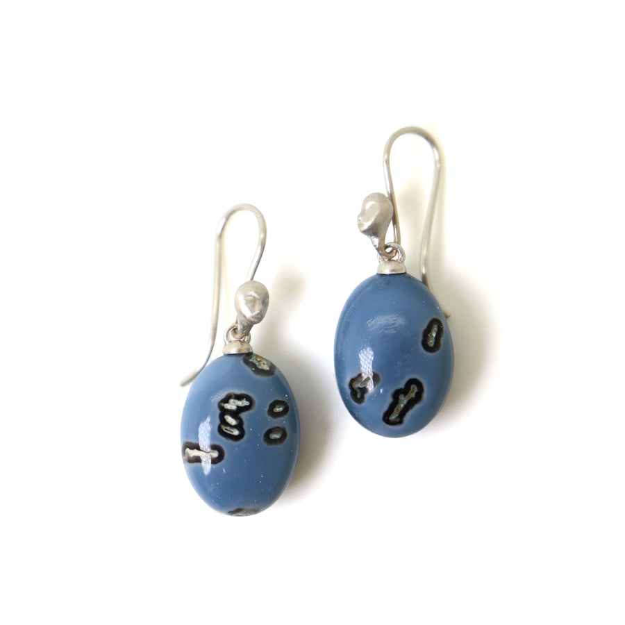 mottled blue common opal oval drops set as earrings with ear wires featuring silver Lady faces