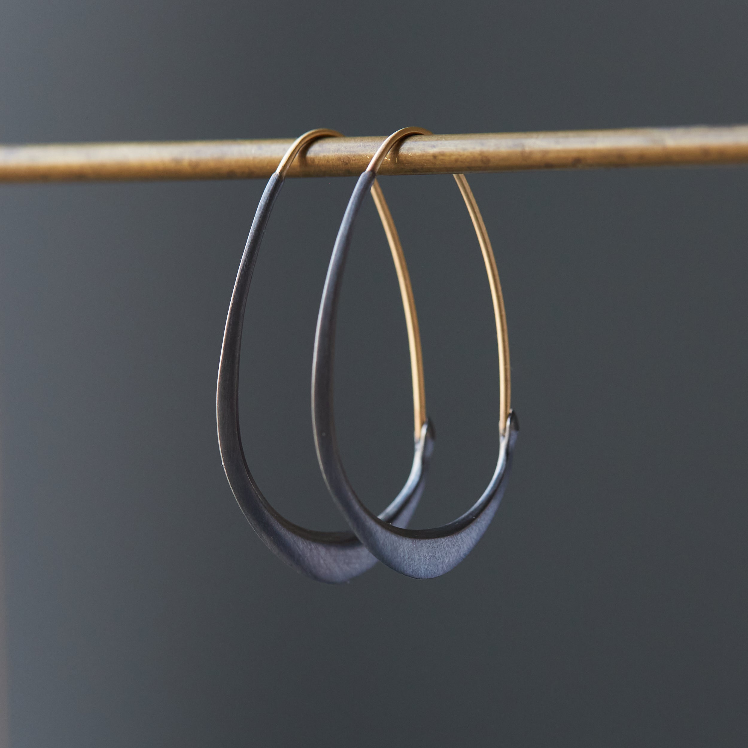 Silver and gold facet hoops by Hannah Blount