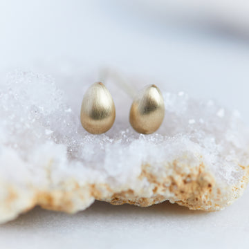Gold egg studs by Hannah Blount