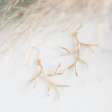 Small gold branch earrings by Hannah Blount