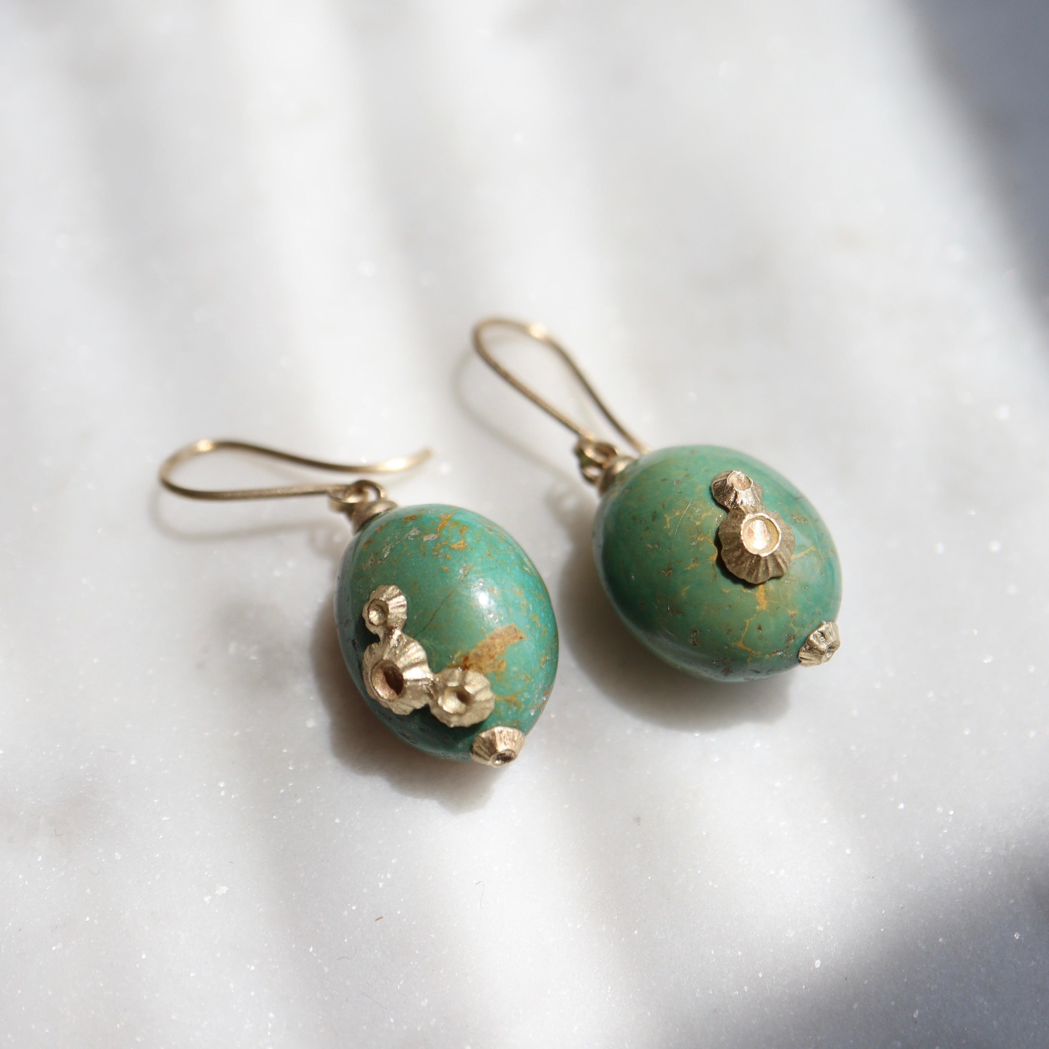 green turquoise earrings with gold barnacles