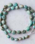 Kingman turquoise necklace with coral-hued silk and silver clasp by Hannah Blount