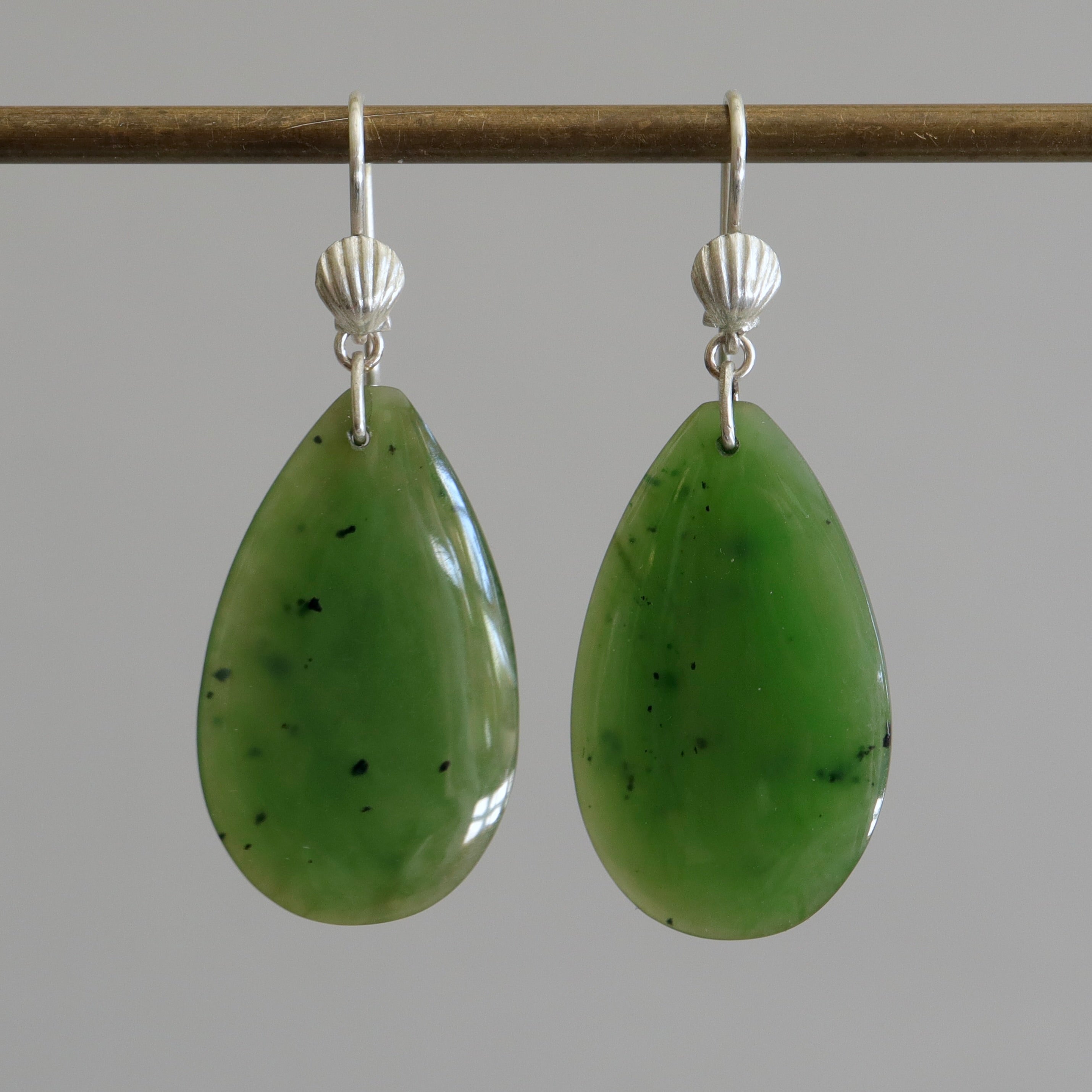 green teardrops under silver scallop ear wires