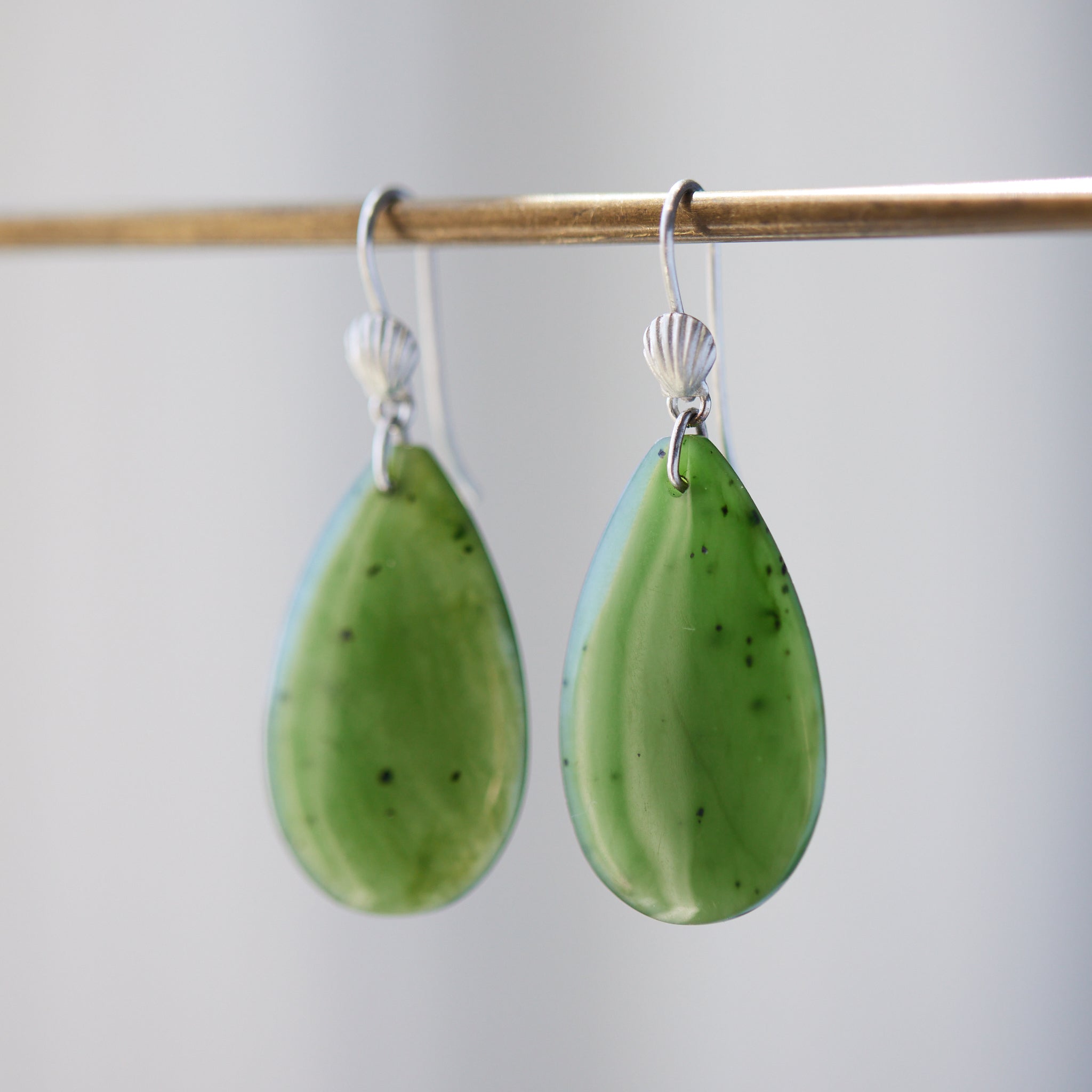 green teardrops under silver scallop ear wires
