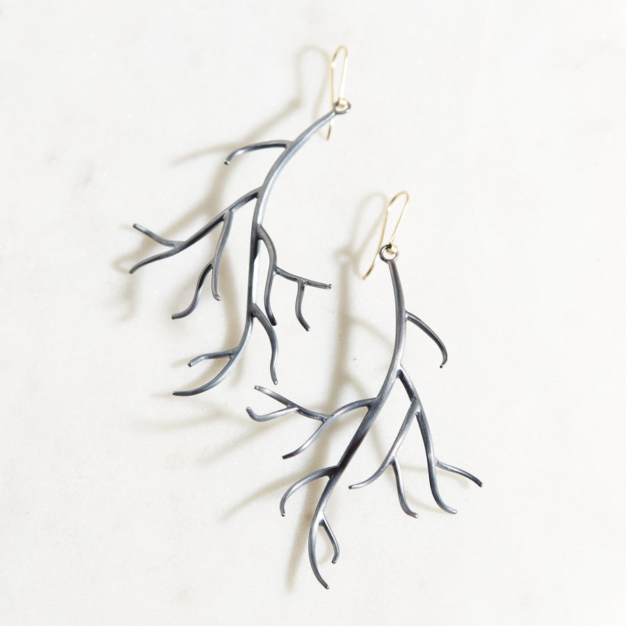 naturalistic branch earrings in oxidized black silver by hannah blount