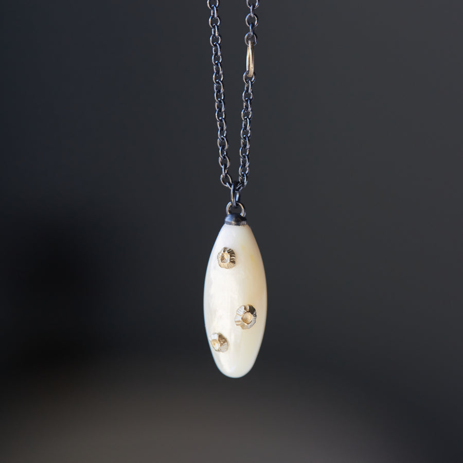 Little mother of pearl necklace with gold barnacles by Hannah Blount