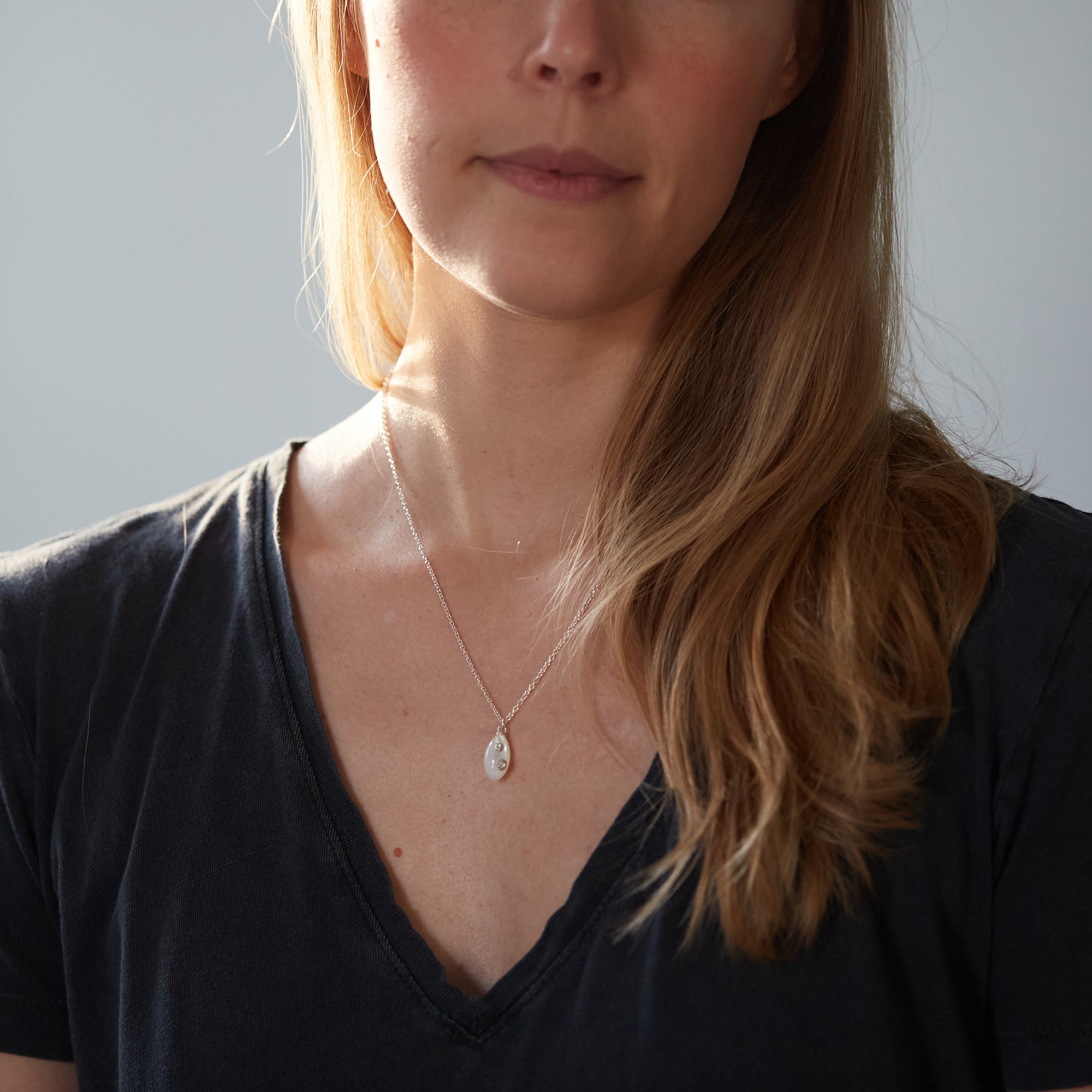 little sized Mother of pearl necklace by Hannah Blount- on person
