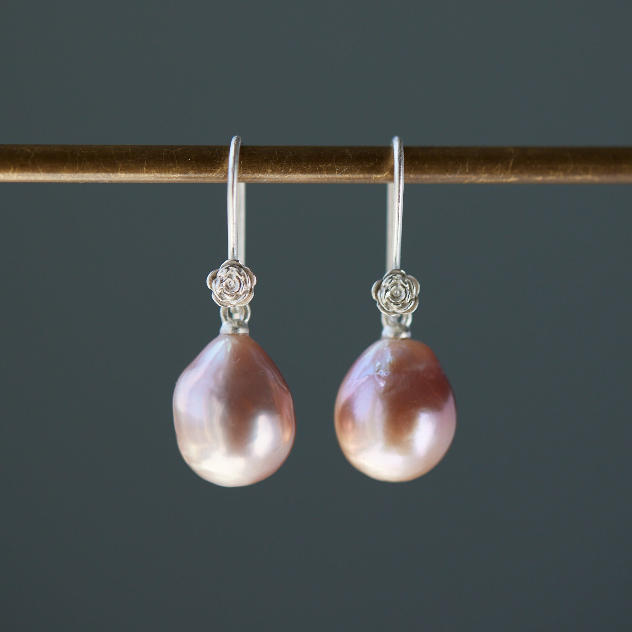 pink pearl drop earrings with bright sterling silver ear wires with rose accents. 