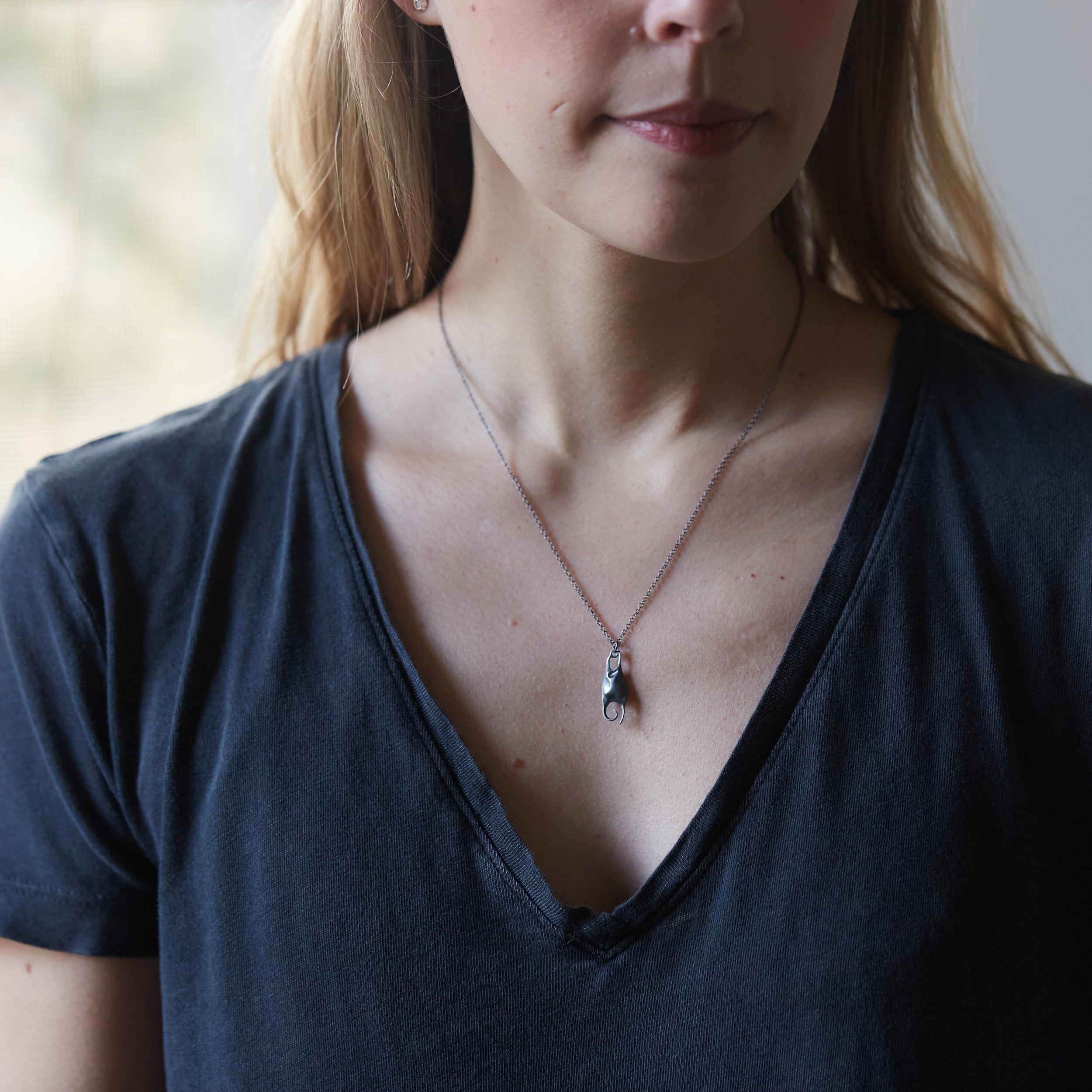 Silver skate necklace by Hannah Blount