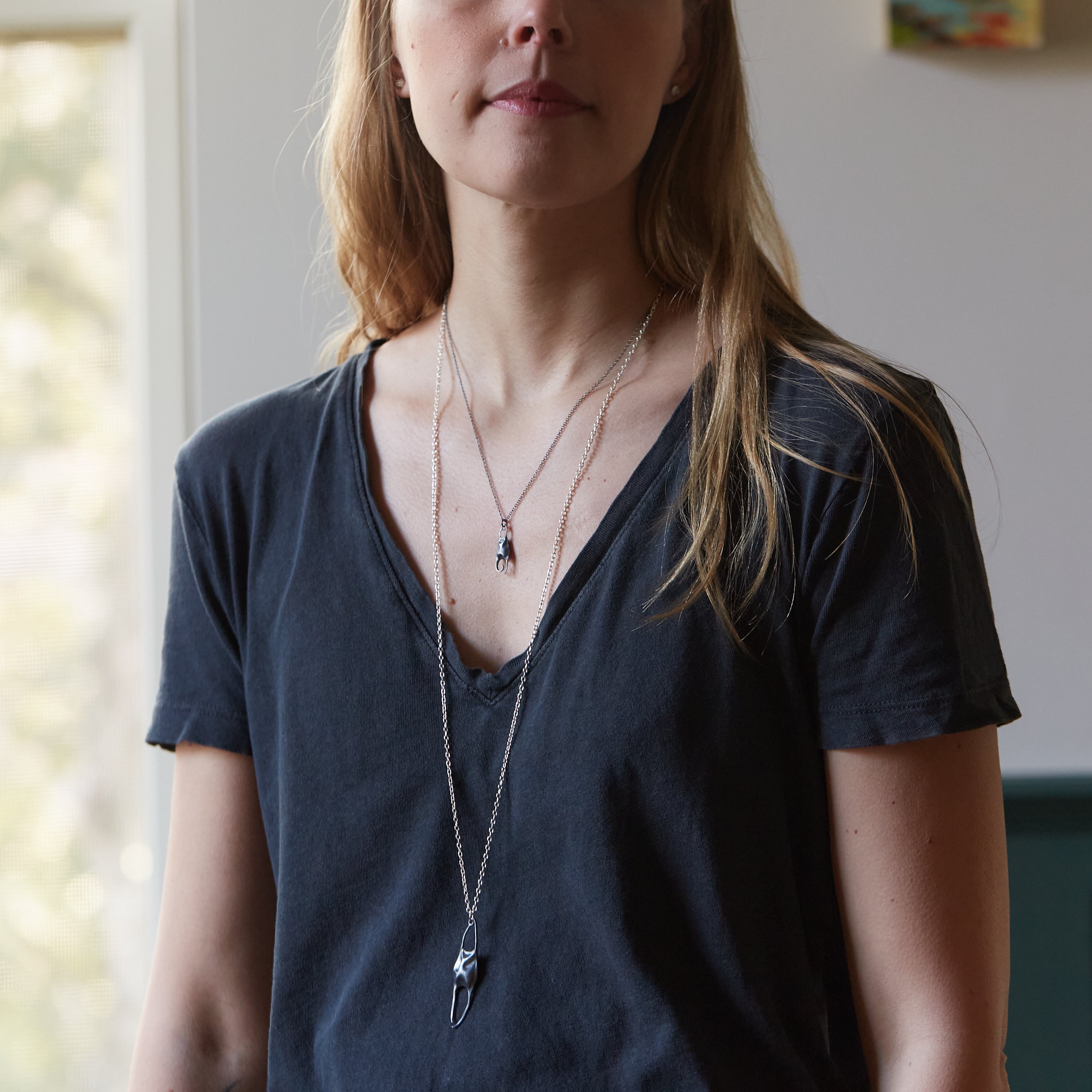 Silver skate necklace by Hannah Blount