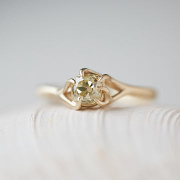 ring of yellow old mine cut diamond set in gold branches by hannah blount