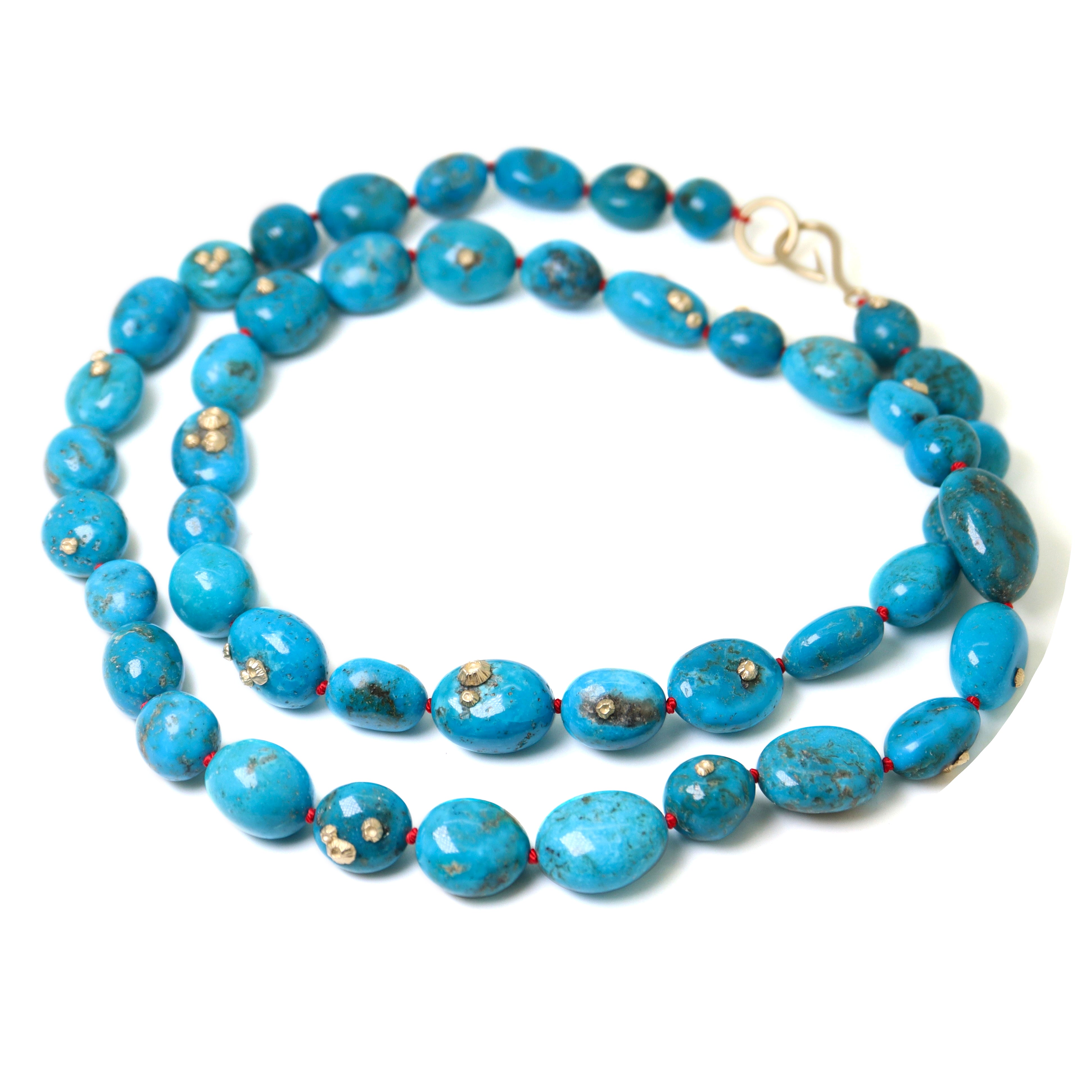 Turquoise beaded necklace with gold barnacles by Hannah Blount